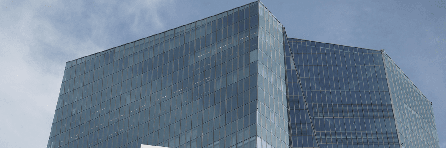 A black glass building with a modern design.