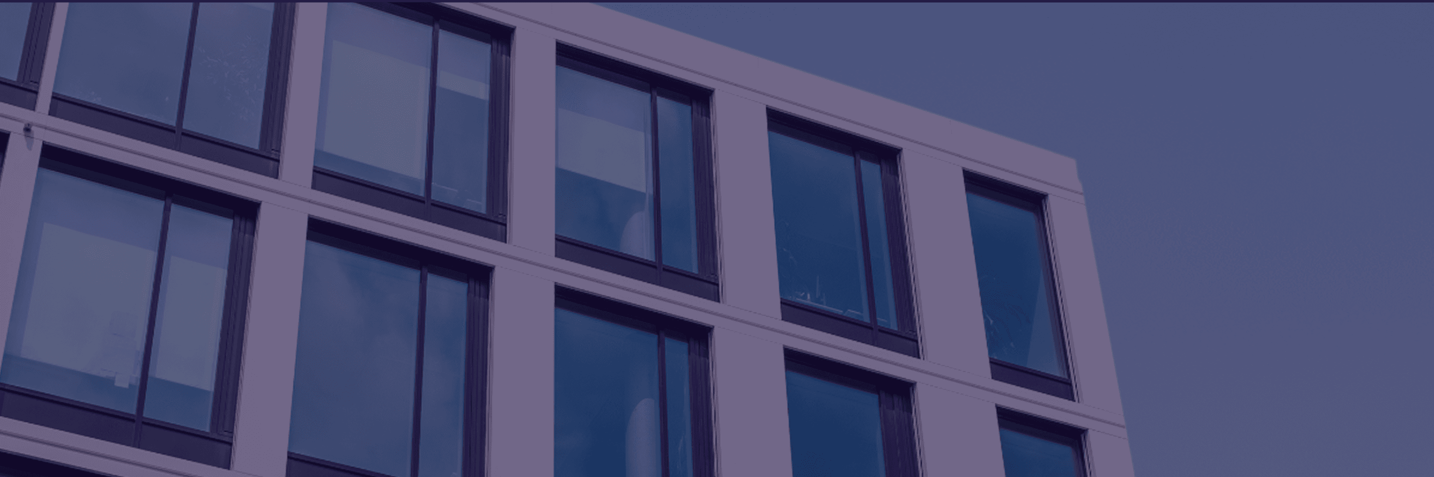 A black glass building with a modern design.