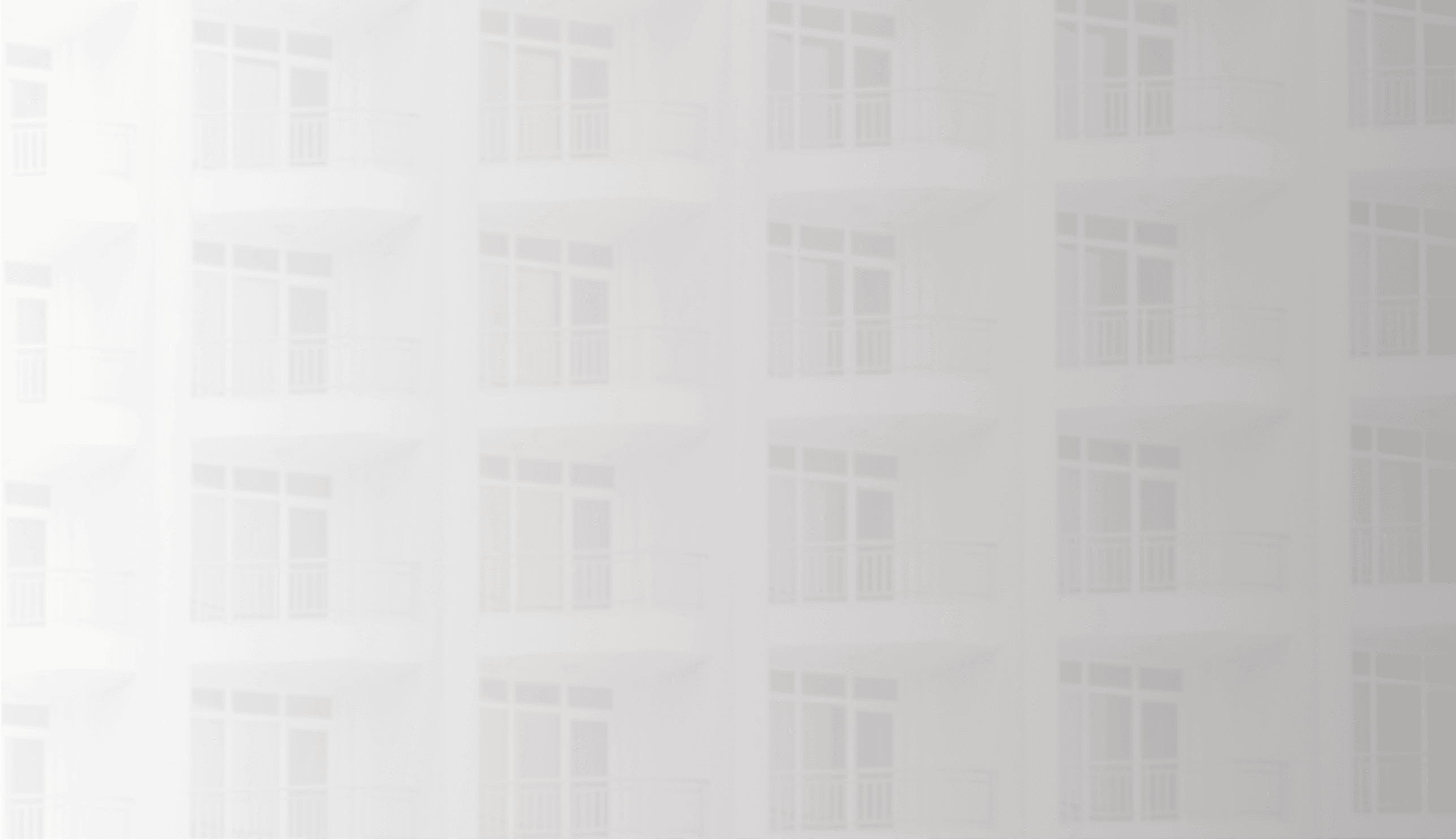 Zoomed-in view of a white building with a modern design.